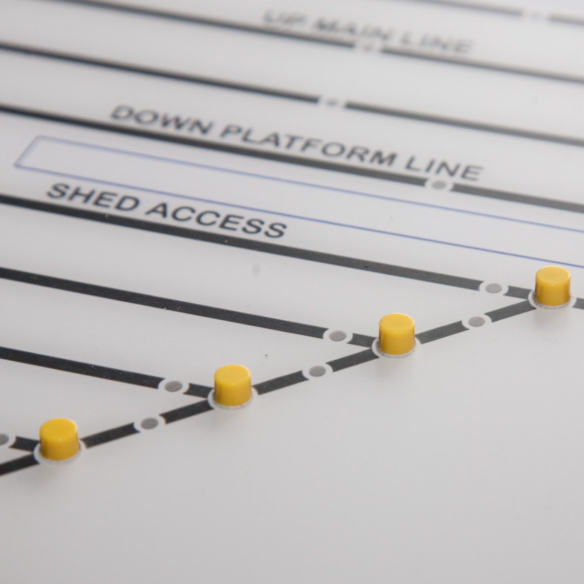 A choice of coloured push-button caps on a bespoke mimic panel.